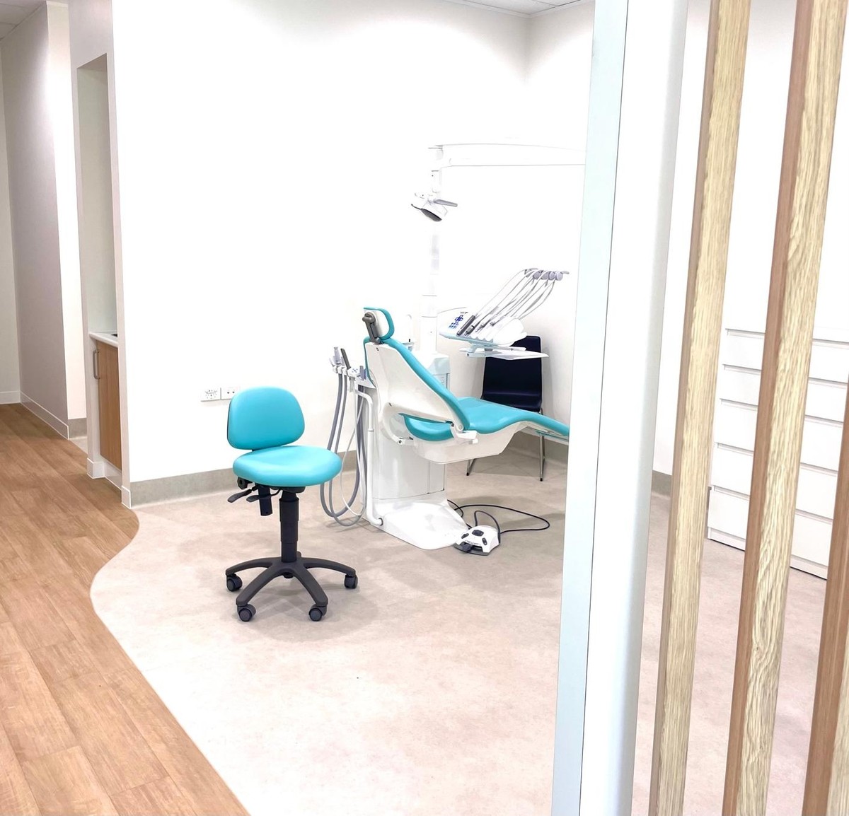 Treatment room at Claremont Orthodontics, viewed through timber slat dividers